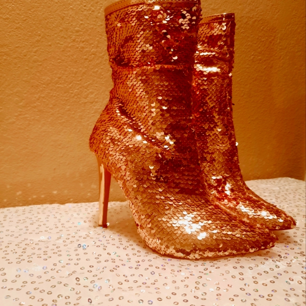 Gold sequin high heel booties.